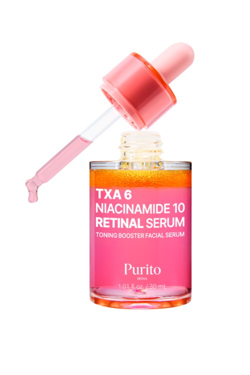 Kleine pinke Flasche mit Tropfer enthält Serum für die Haut, bezeichnet als Niacinamide und Retinol fürs Gesicht.
