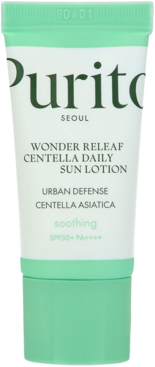 En grøn og hvid tube mærket Purito Wonder Releaf Sunscreen med SPF 50+ for beroligende hudbeskyttelse.