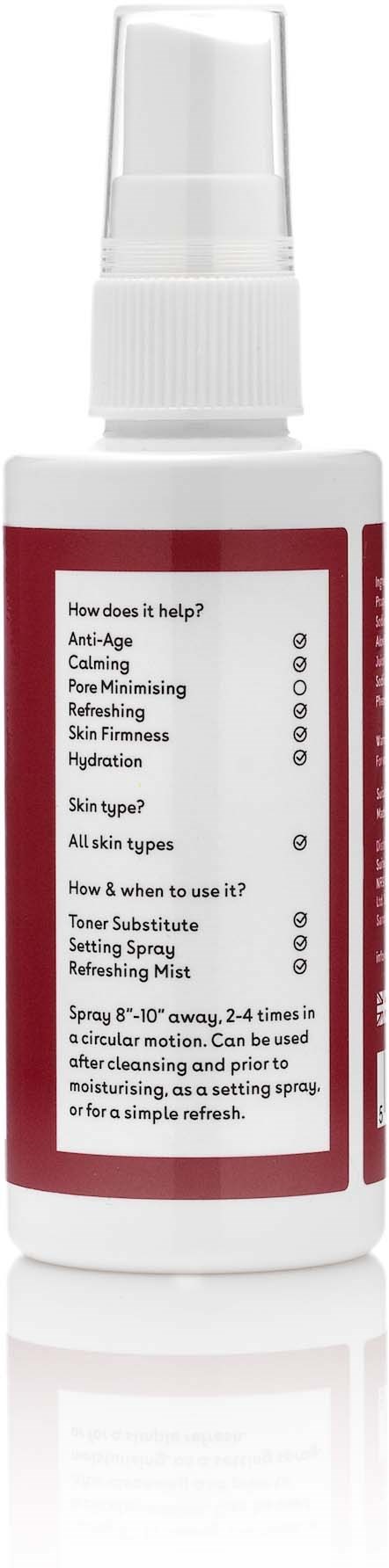 A white spray bottle with a label showing usage instructions and benefits for skin, ready to spray on face.