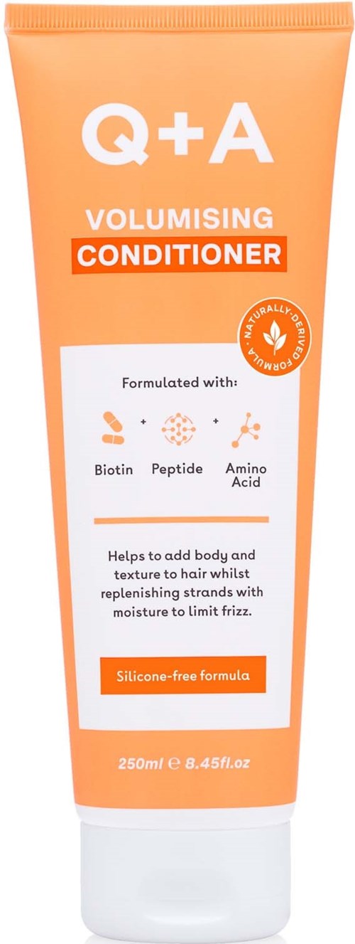 A peach-colored tube labeled Q+A Volumising Conditioner that helps add body and texture to hair.