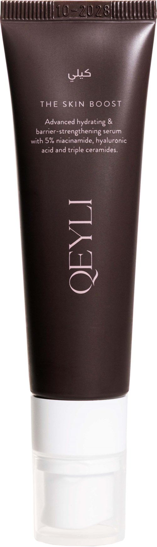 Olay The Skin Boost serum i en mörkbrun tub med vit lock, märkt med produktnamn och ingredienser.