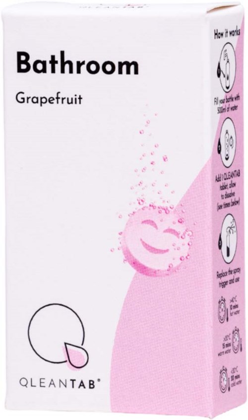 Låda med ett leende ansikte, rosa bubblor och instruktioner för att använda en badrumsprodukt med grapefruktsdoft.
