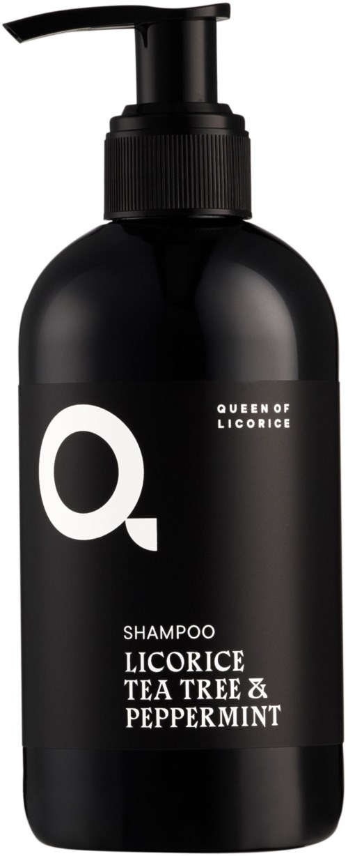 Czarna butelka szamponu z pompką, oznaczona Queen of Licorice, zapach herbaty z drzewa i mięty.