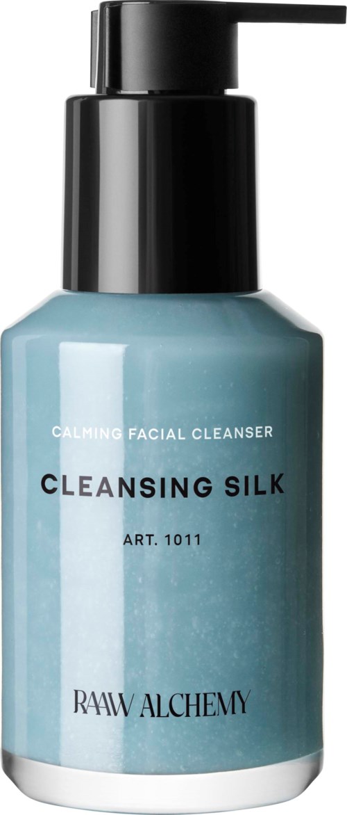 A blue face cleanser bottle with a pump, labeled 'Cleansing Silk' and 'Calming Facial Cleanser'.