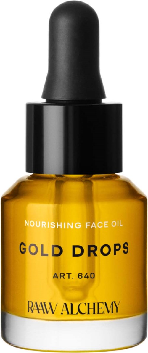 A small amber bottle with a black dropper labeled 'Nourishing Face Oil Gold Drops' from Rawi Alchemy.