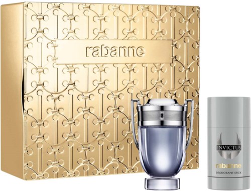 Ett parfympresentset med guldbox, en silverflaska och en vit deodorantstift.