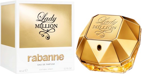 Lady Million parfumfles ziet eruit als een gouden edelsteen. De doos is goudkleurig en wit met merknamen.