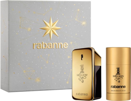 Ett presentset med en parfåmol, och deodorant, båda i guld och svart, i en dekorerad vit låda.