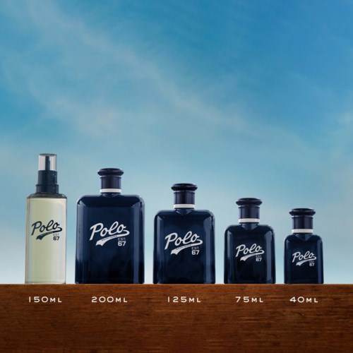 Five bottles of different sizes aligned from largest to smallest against a blue sky background.