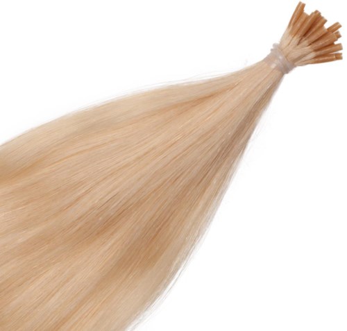 Blond hårförlängningar knutna i ena änden, flyter smidigt.