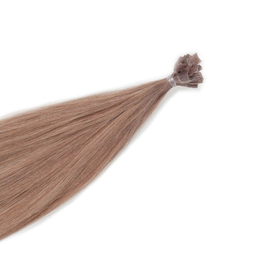 En bunt rakt, blond hår som är knutet i ena änden med ett klart elastisk band.
