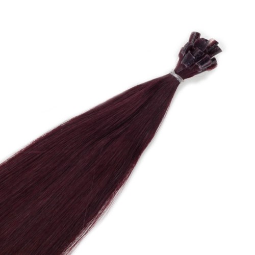 En bunt med långa, raka, mörkbruna eller burgundy hårförlängningar som är knutna i ena änden.