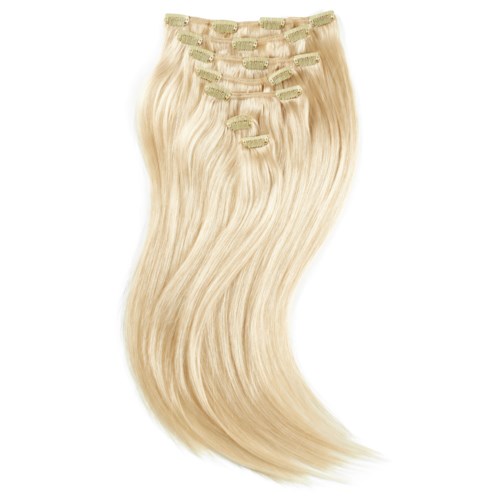 Clips hold long, blonde hair extensions straight, shiny, and neatly organized in a row.