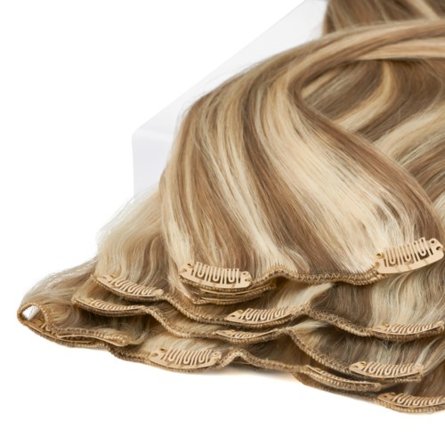 Extensions for hair styling, color is blonde, curled and layered, placed on a white background.