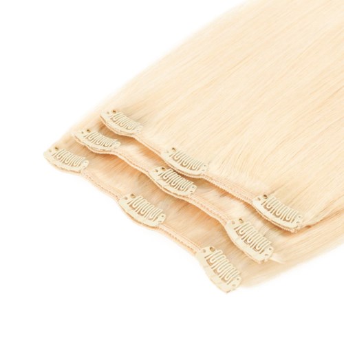 Tre beige tygbitar staplade med etiketter som heter "MooMoo" på ändarna.