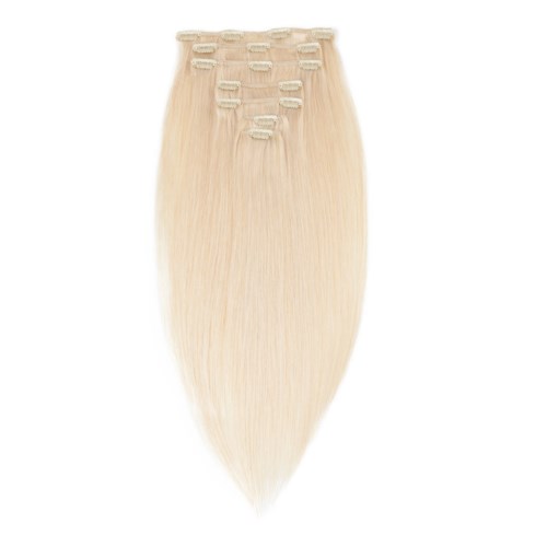 Blonder hårförlängning med små clips, placerade i en rad upptill.
