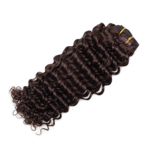 A bundle of dark curly hair extensions tied with yellow bands, ready to be attached for styling.