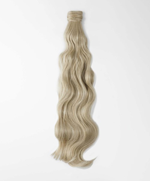 A bundle of long, wavy blonde hair extensions tied at the top and hanging down.