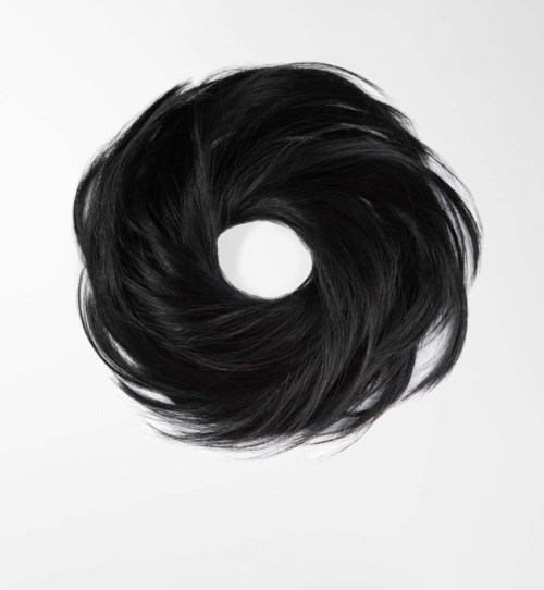A black hair donut with shiny, smooth hair arranged in a circular shape.