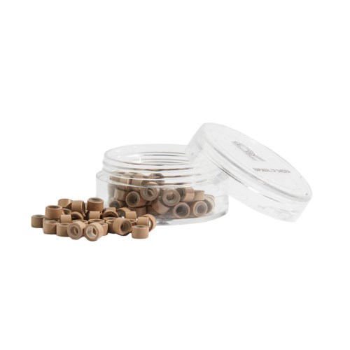 A small clear plastic container with brown earplugs, some outside and lid nearby.