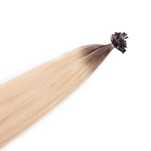 En bunt långt blont hår bundet med en svart snodd, flytande nedåt.