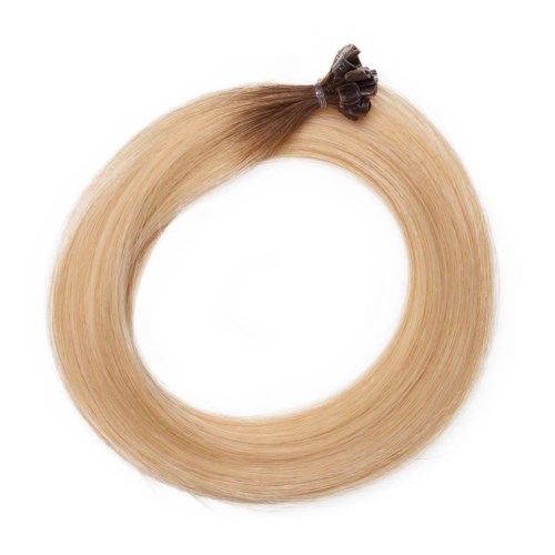 Blont hårstrå formad till en cirkel med en liten hårklämma upptill.