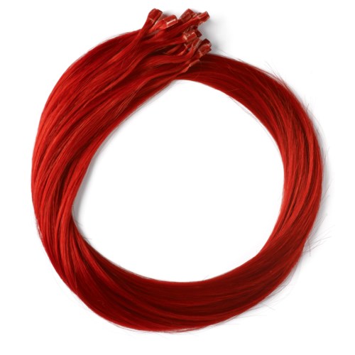 Ett stort, cirkulärt, rött hårband eller hårklämma med en lös ände upptill.
