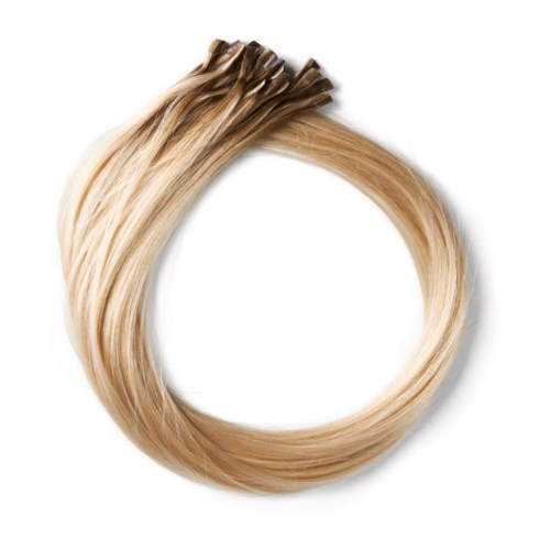 En loop av blont hårförlängning eller vlies, knuten i ena änden, med glänsande, slätt hår.