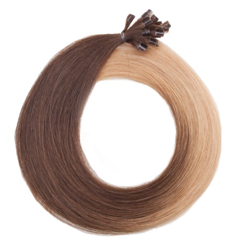 Hårfärgsövergång från mörkbrunt till blont, stylad i en cirkel med hårklämmor upptill.