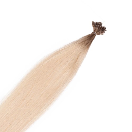 En knippa av rakt, blont hår som är knutet i ena änden.