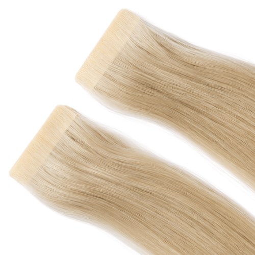 Two blonde hair extensions or wigs, smooth and shiny, placed diagonally on a white background.