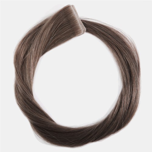 A circular arrangement of brown, straight hair with a top section folded over, on a white background.