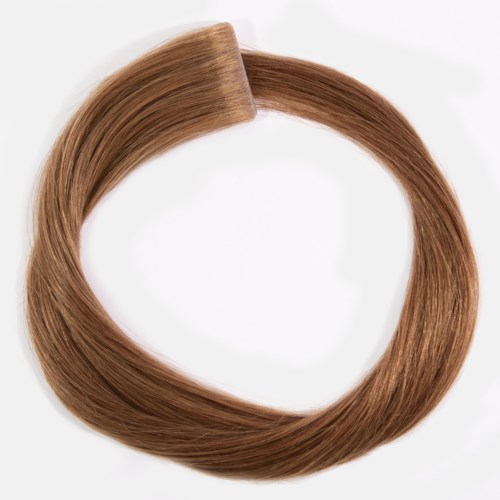 A circle of smooth, light brown hair arranged neatly on a white background.