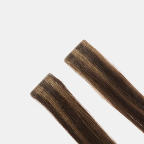Two hair extension pieces with long, straight, brown hair. They are placed diagonally on a plain background.