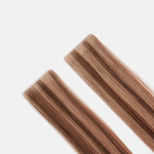 Two hair color samples with brown shades placed diagonally on a white background.
