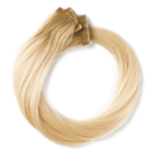 Blonda hårförlängningar eller perukdelar i en cirkel med en klämma upptill.