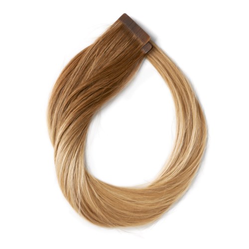 En hårförlängning i ljusbrunt till blont, formad som en ring.