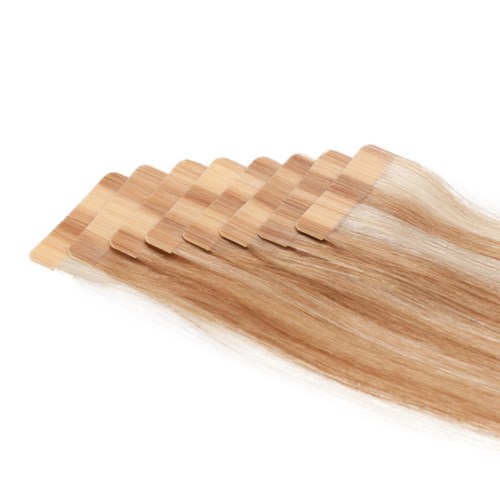 Multiple light brown wooden hairbrushes with wide, flat bristles are fanned out. They look clean and new.