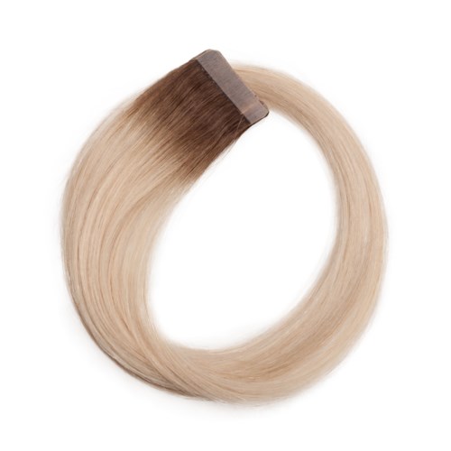 En hårförlängning eller peruk med blandade ljusblonda och bruna färger i en cirkel.