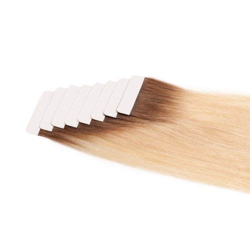 Hårfärgsprov på små vita kort, som visar en gradient från mörkbrunt till blont.