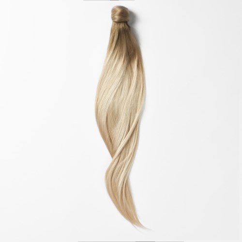 Ein Bündel langes, blonden Haars, oben gebunden, mit sanften Wellen nach unten.