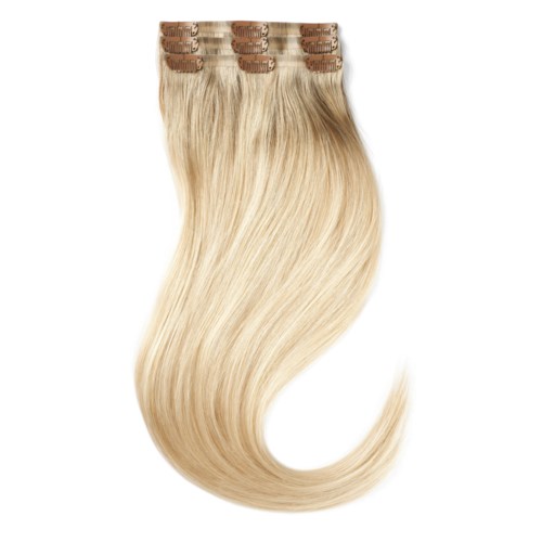 Blonde hair extensions with clips, arranged in a slightly curved line. The hair is long and shiny.