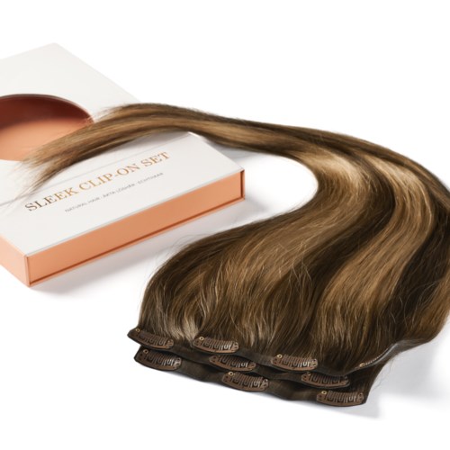 A hair extension set with a brown clip-on system and long, shiny hair strands.