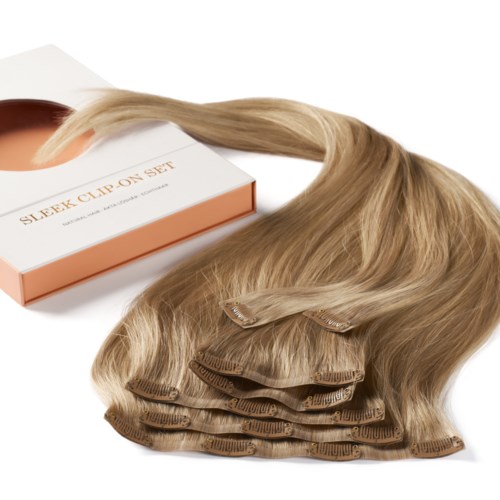 Hair extensions and clips on a white background, with a box labeled "Sleek Clip-On Set."