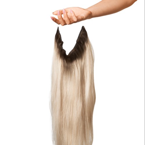 A hand holds a section of long, blonde hair against a white background.