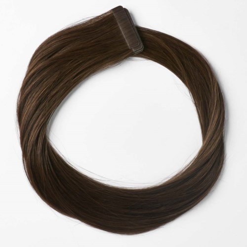 A hair extension or wig loop with brown hair and a clip, arranged in a circle.