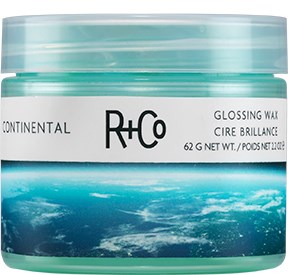 En behållare med glansvax med en blå havsvågdesign, märkt 'Continental' och 'R+Co'.