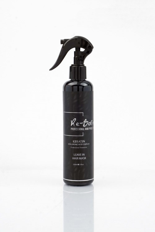 En svart sprayflaska med trigger, märkt 'Re-Bond' och 'Leave In Hair Mask'.
