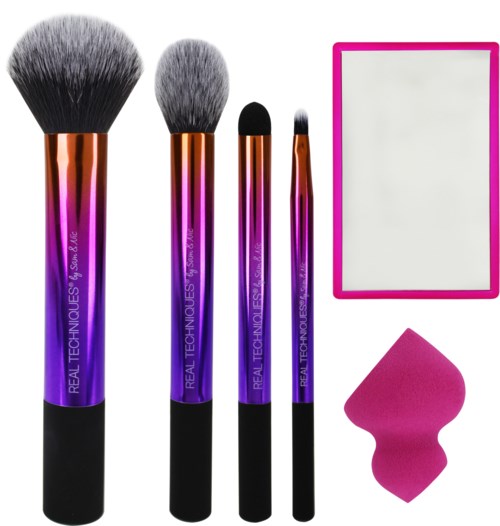 Set med makeupborstar, spegel och svamp i rosa och svarta färger.
