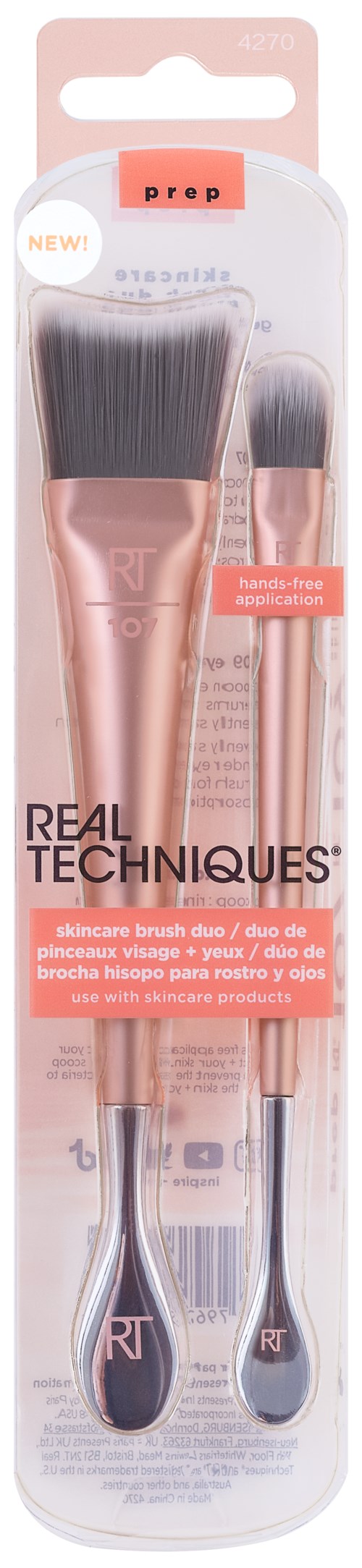 Ett par makeuppenslar, en stor och en liten, med roséguldhandtag och svarta borst, i förpackning.